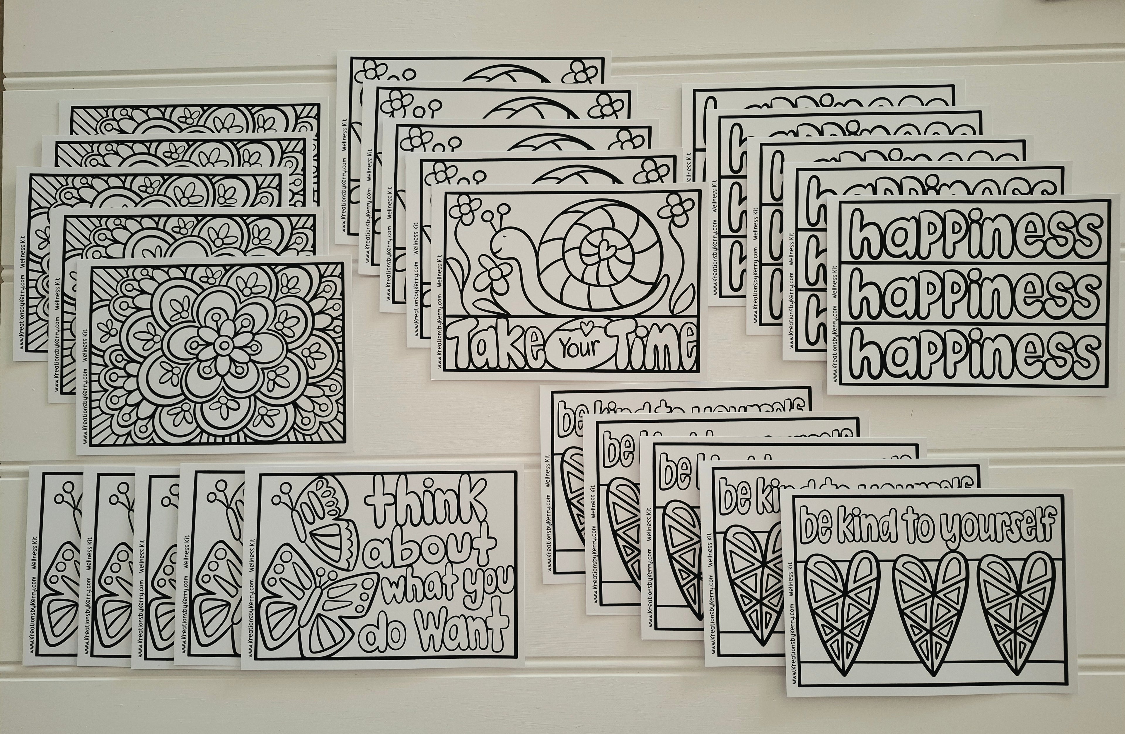 A set of black and white printable cards or stickers with motivational quotes and doodle designs, arranged in overlapping rows on a white surface. Visible text includes phrases like 'happiness happiness happiness,' 'think about what you do want,' 'be kind to yourself,' and 'take your time.